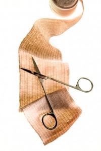 Surgical scissors on roll of guaze